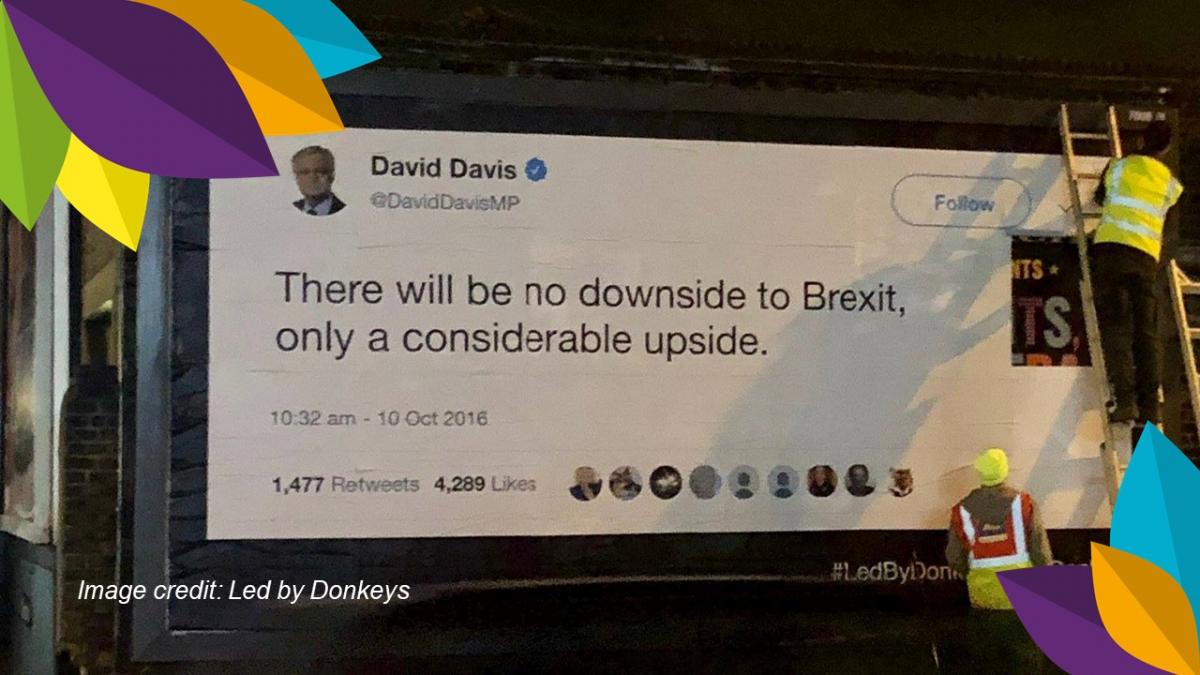 Tweet from David Davis posted on a banner: "There will be no downside to Brexit, only a considerable upside."